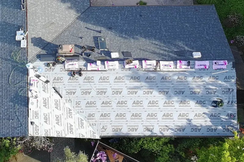 Aerial view of an Owens Corning Duration roof replacement underway in Moraga, CA, with underlayment going down