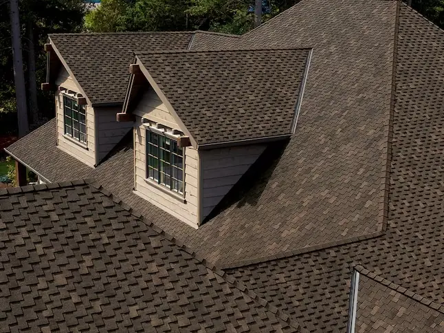 Owens Corning Woodcrest shingles on a house with dormers